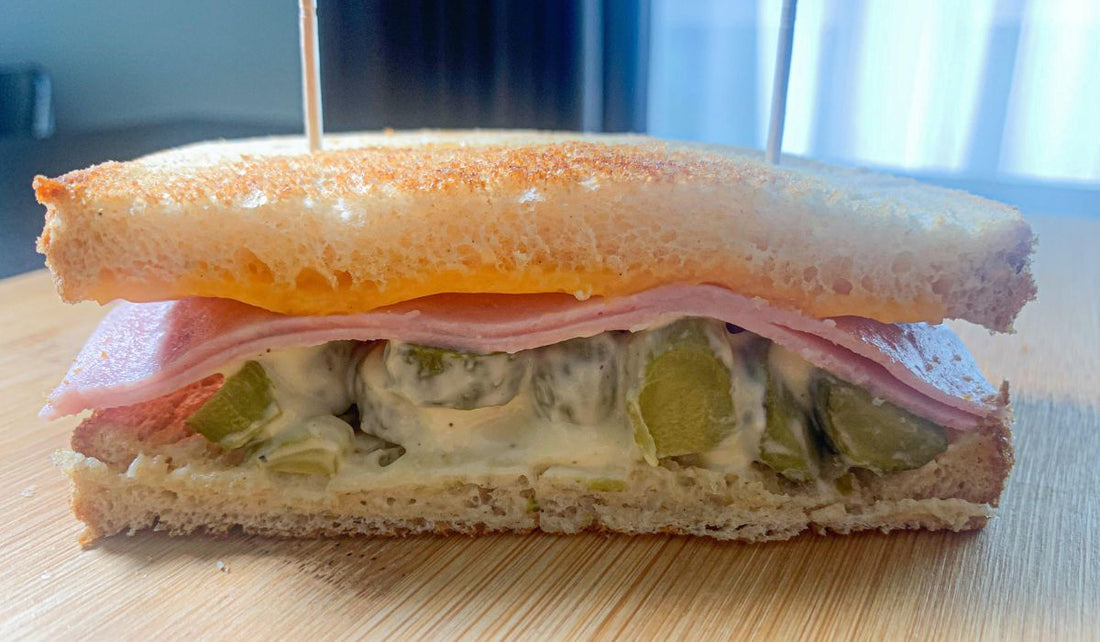 Ham and cheese sandwich with pickles and mayonnaise sauce